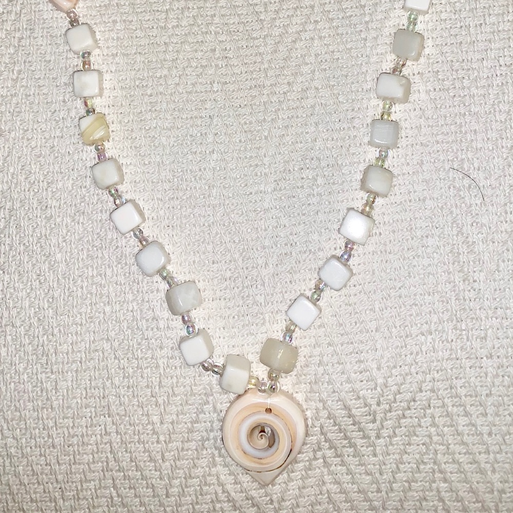 White beaded necklace.
